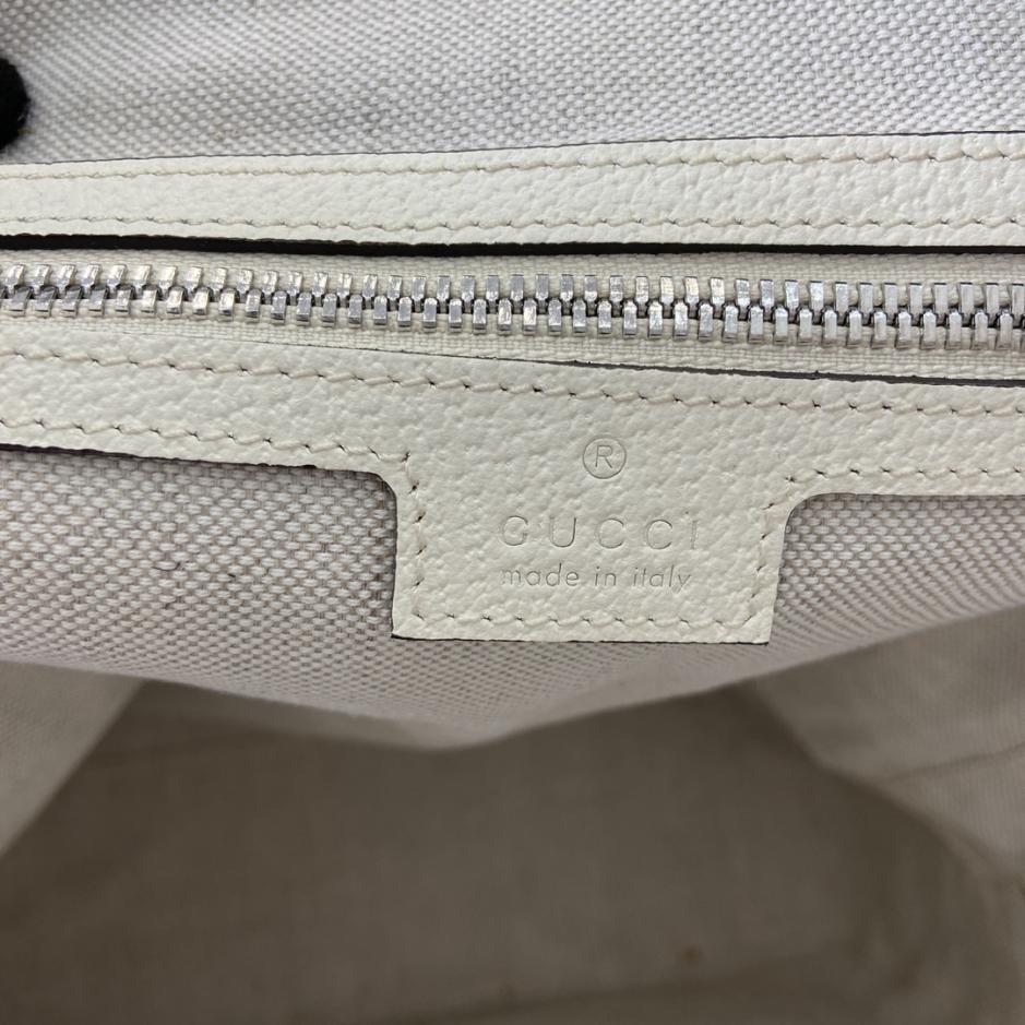 Mini borsa a tracolla Gucci zaino GG medio con firma GG